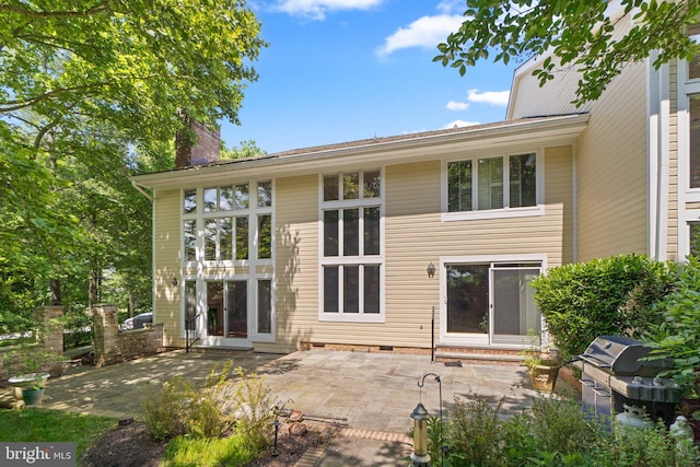 rear view of house with a patio