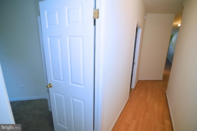 hall with light hardwood / wood-style floors