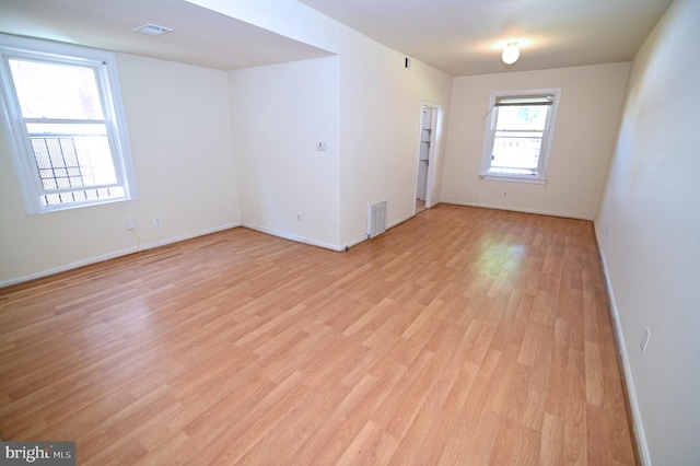 empty room with light hardwood / wood-style floors