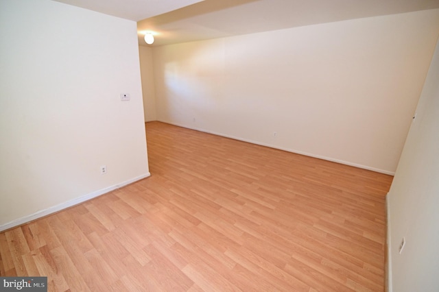 empty room with light wood-type flooring