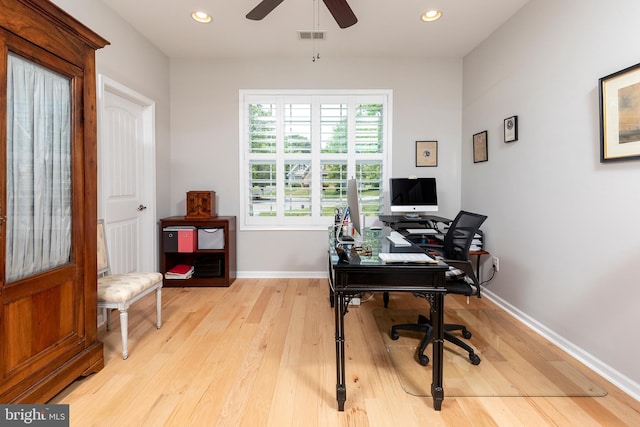 home office with ceiling fan and light hardwood / wood-style floors