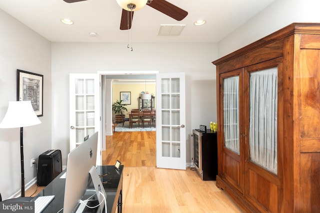 doorway to outside featuring french doors, light hardwood / wood-style floors, and ceiling fan