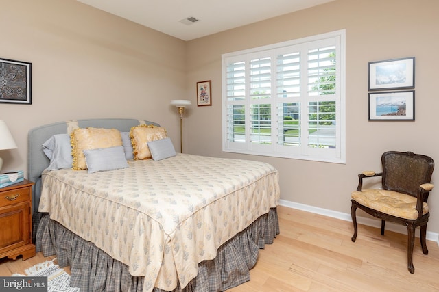 bedroom with light wood-type flooring