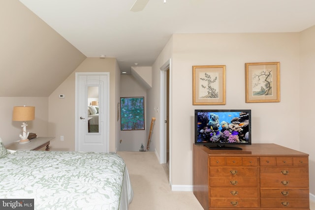 carpeted bedroom featuring ceiling fan and lofted ceiling