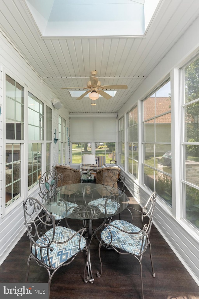 sunroom / solarium with a skylight, ceiling fan, and a healthy amount of sunlight