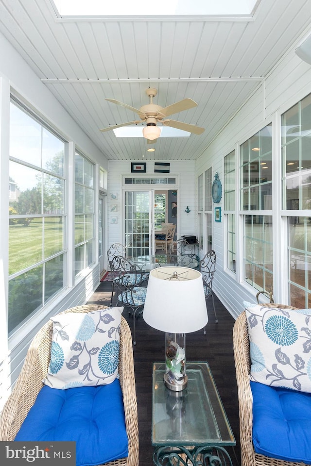 sunroom / solarium featuring ceiling fan and a wealth of natural light