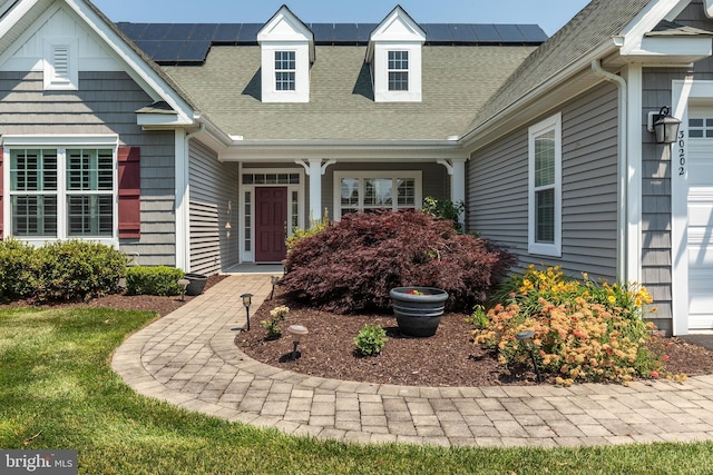 entrance to property featuring solar panels