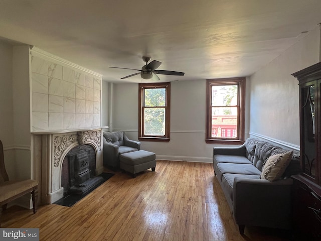 living area featuring ceiling fan and wood-type flooring