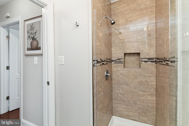 bathroom with a tile shower