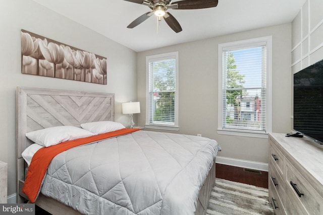 bedroom featuring hardwood / wood-style floors and ceiling fan