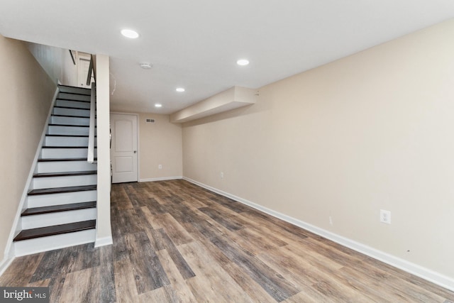 basement featuring dark hardwood / wood-style floors