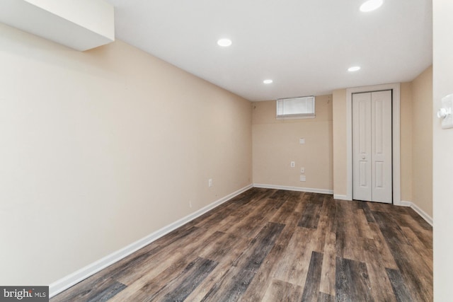 basement featuring dark wood-type flooring