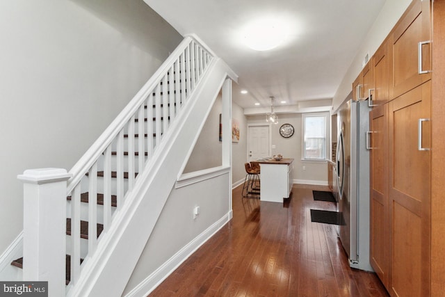 stairs featuring wood-type flooring