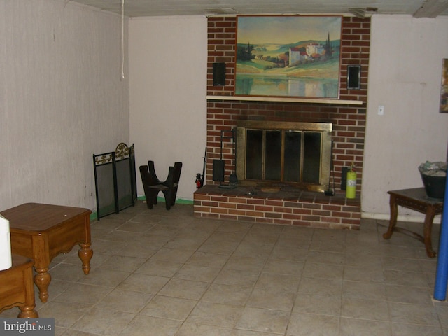 living room with a brick fireplace