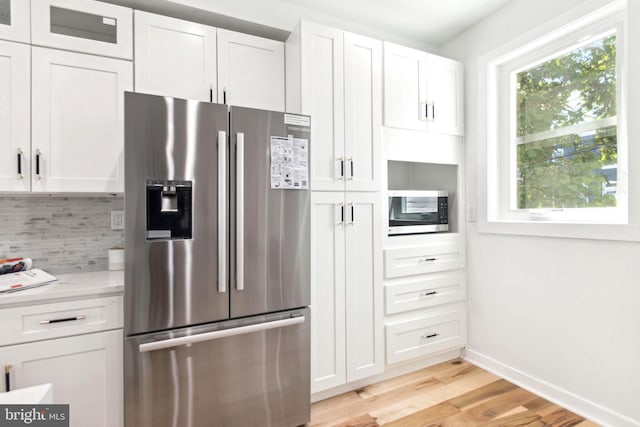 kitchen featuring white cabinetry and stainless steel appliances