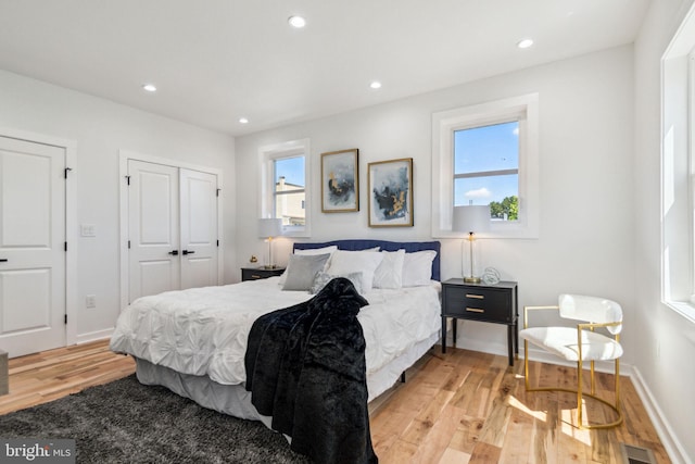 bedroom with light hardwood / wood-style flooring