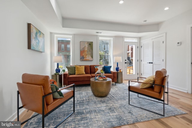 sitting room with hardwood / wood-style flooring