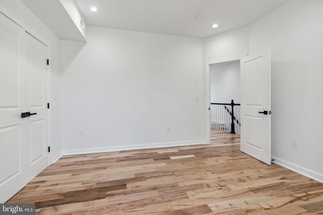 unfurnished room with light wood-type flooring