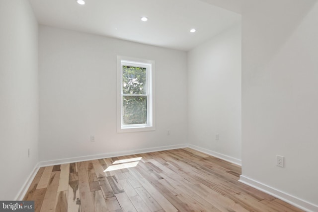 unfurnished room with light hardwood / wood-style flooring