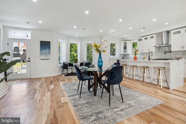 dining space featuring light wood-type flooring