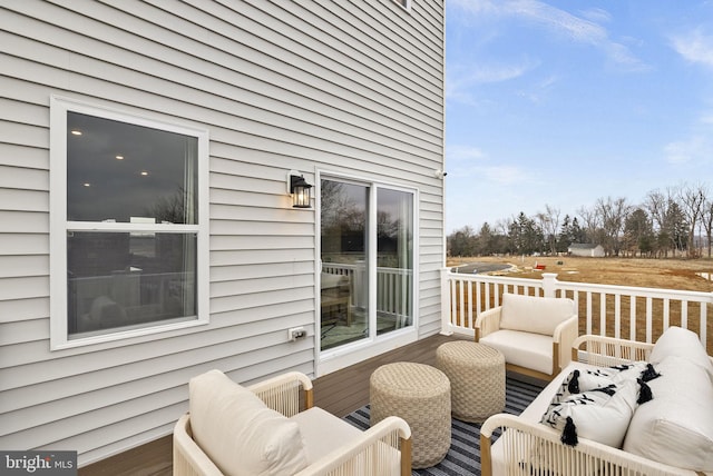 deck featuring outdoor lounge area