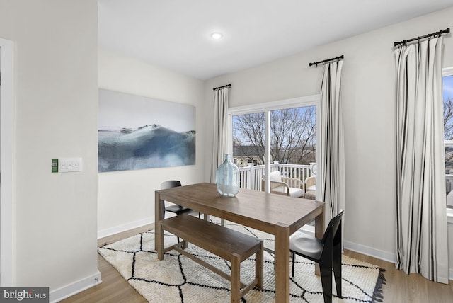 dining space with light wood-type flooring