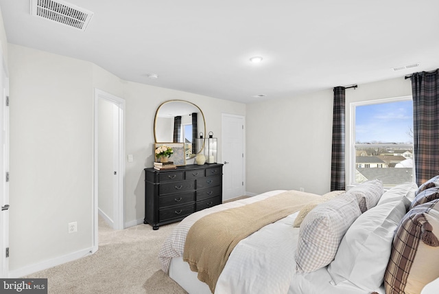 bedroom with light colored carpet