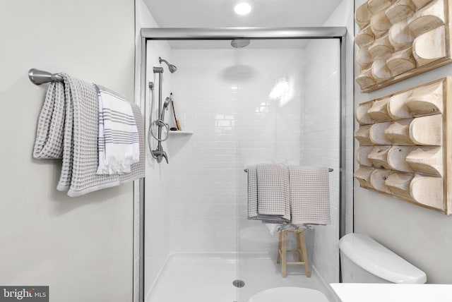 bathroom with walk in shower and toilet