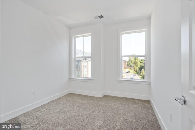 unfurnished room featuring carpet floors