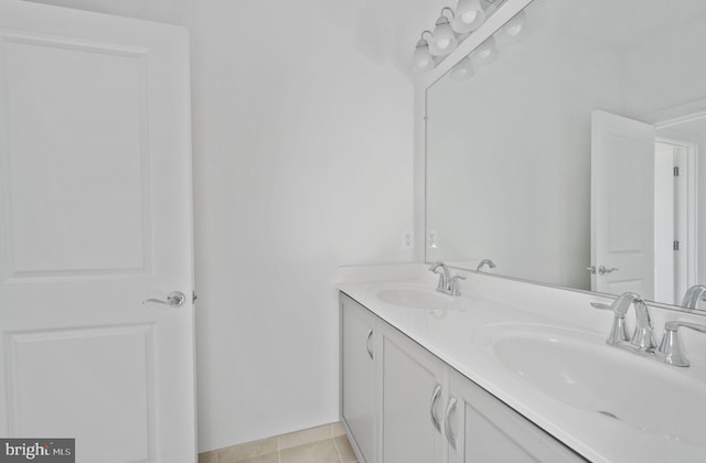 bathroom featuring tile patterned flooring and vanity