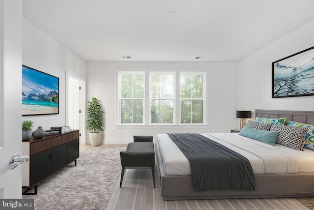 bedroom featuring light hardwood / wood-style floors