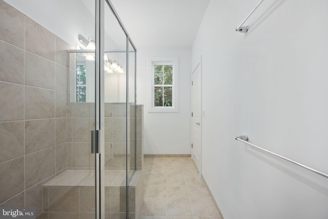 bathroom featuring walk in shower and tile patterned flooring