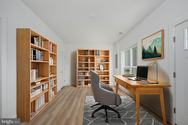 home office featuring hardwood / wood-style flooring