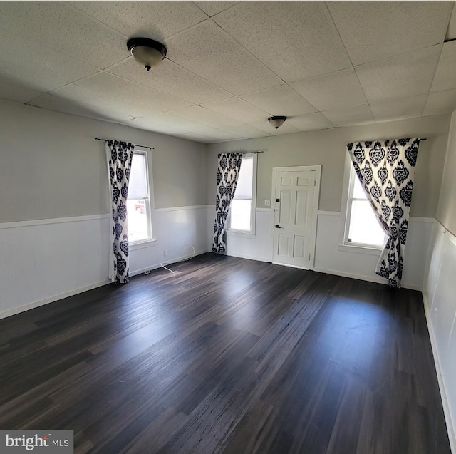 foyer featuring a paneled ceiling and dark wood-type flooring