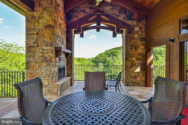 view of patio / terrace with an outdoor stone fireplace