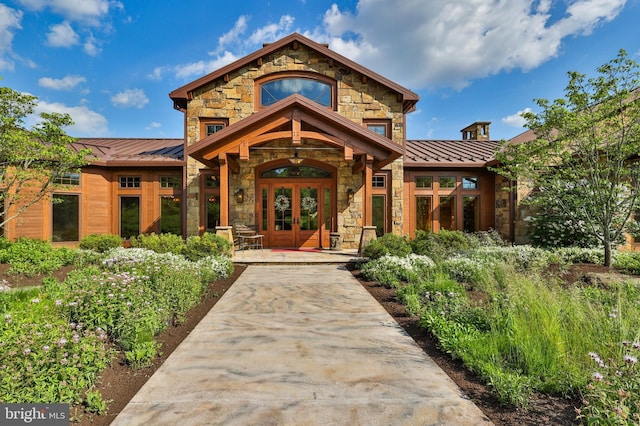 view of exterior entry featuring french doors