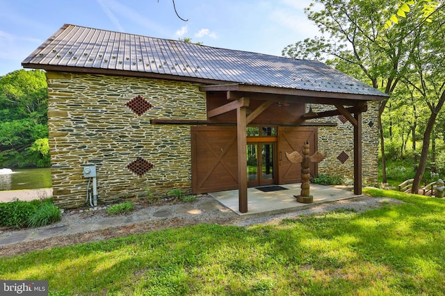 exterior space with a yard, french doors, and a patio