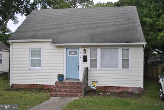 new england style home with a front yard