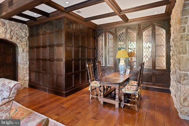 dining space with beamed ceiling, wood-type flooring, and coffered ceiling