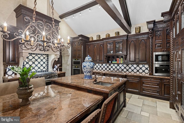 kitchen featuring sink, hanging light fixtures, decorative backsplash, beamed ceiling, and dark brown cabinets