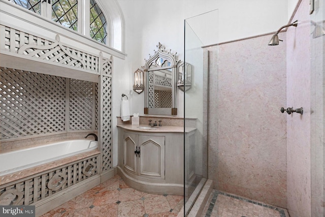 bathroom featuring tile patterned floors, vanity, and independent shower and bath