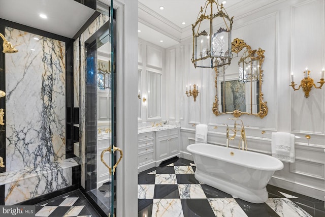 bathroom with a tub to relax in, vanity, and ornamental molding