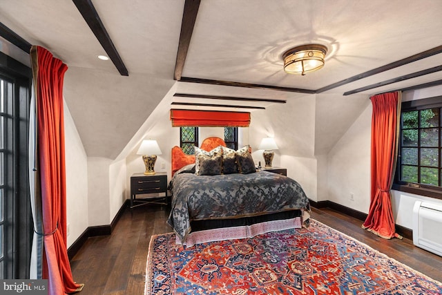 bedroom featuring vaulted ceiling with beams and dark hardwood / wood-style flooring