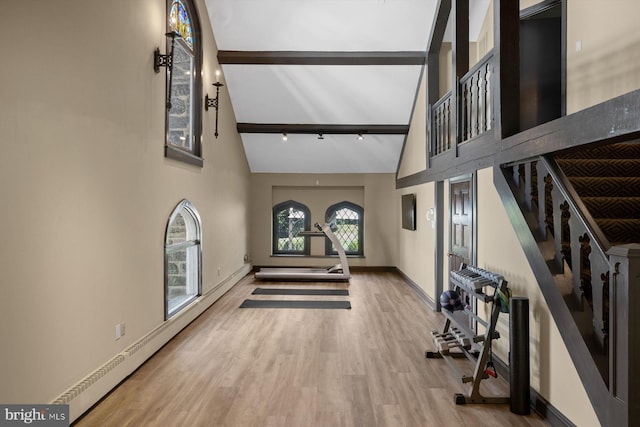 foyer entrance featuring hardwood / wood-style flooring, beamed ceiling, and high vaulted ceiling