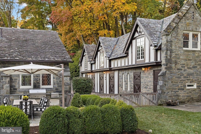 back of house with exterior kitchen