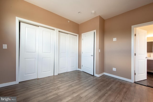 unfurnished bedroom with wood-type flooring