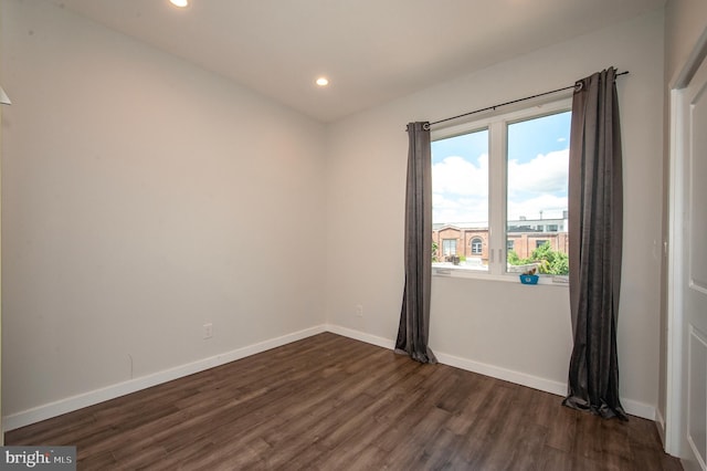 empty room with dark hardwood / wood-style floors