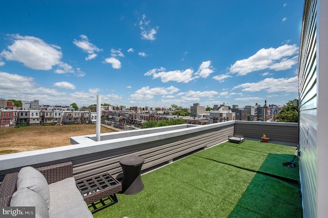 view of yard with a balcony