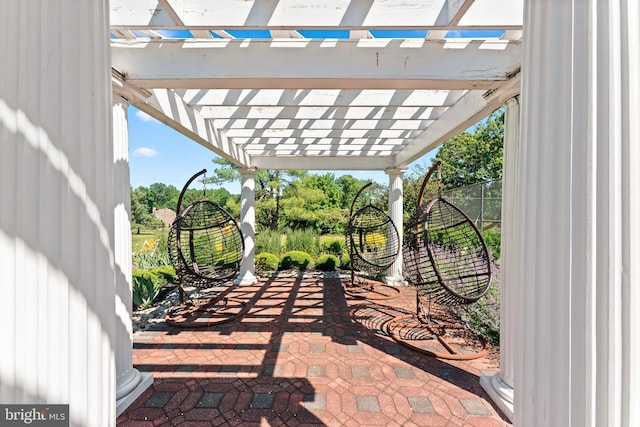 view of patio featuring a pergola