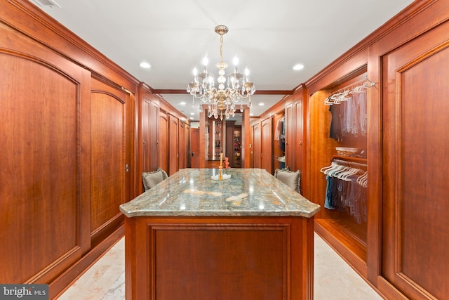 walk in closet featuring a notable chandelier